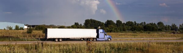 Truck driving with rainbow